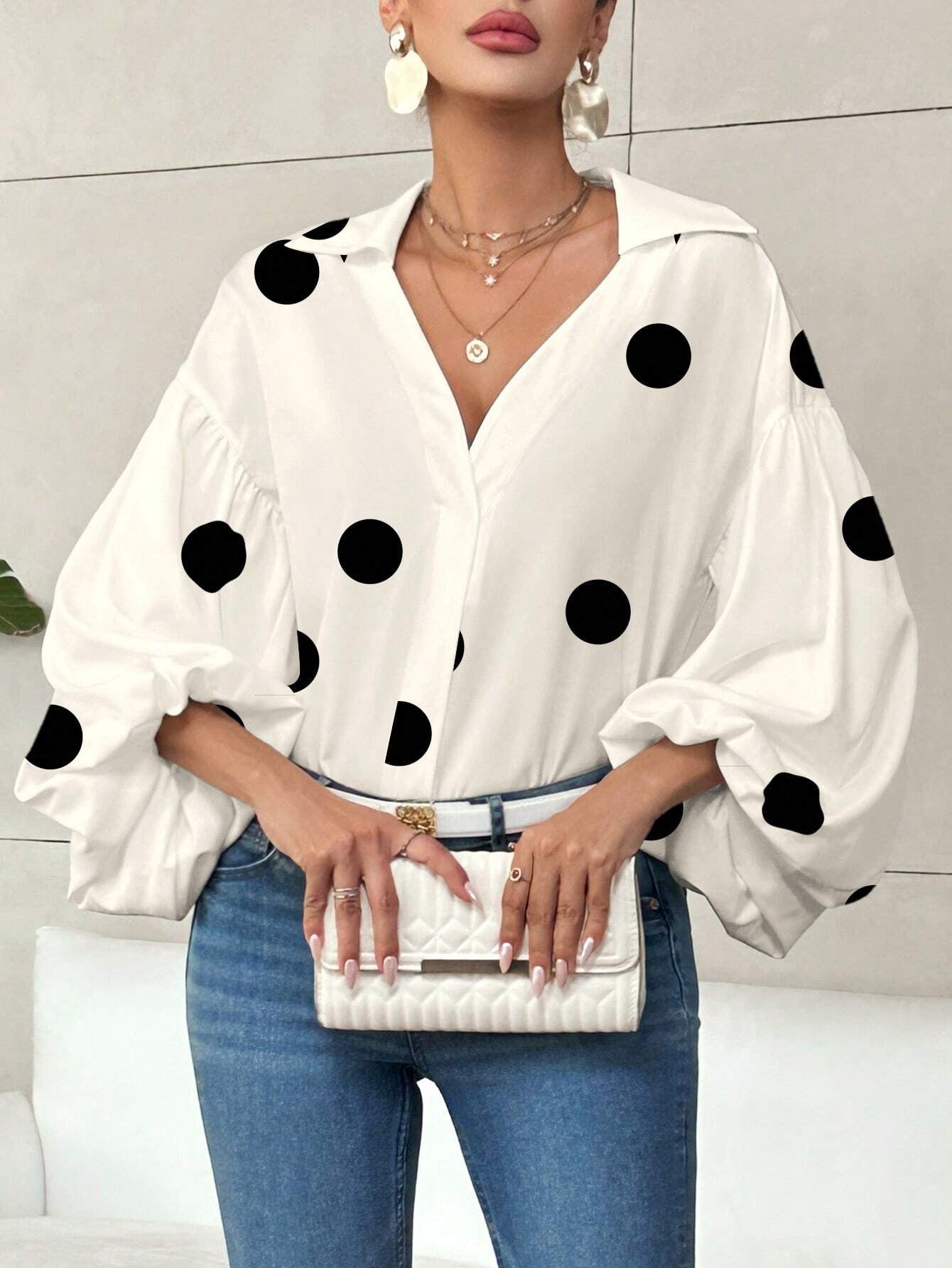 Long-sleeve polka dot top with a half-zip neck