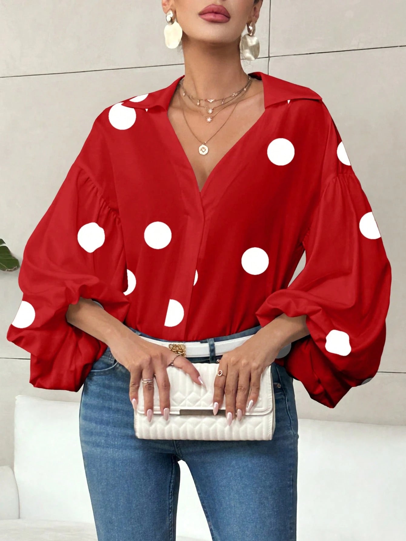 Long-sleeve polka dot top with a half-zip neck