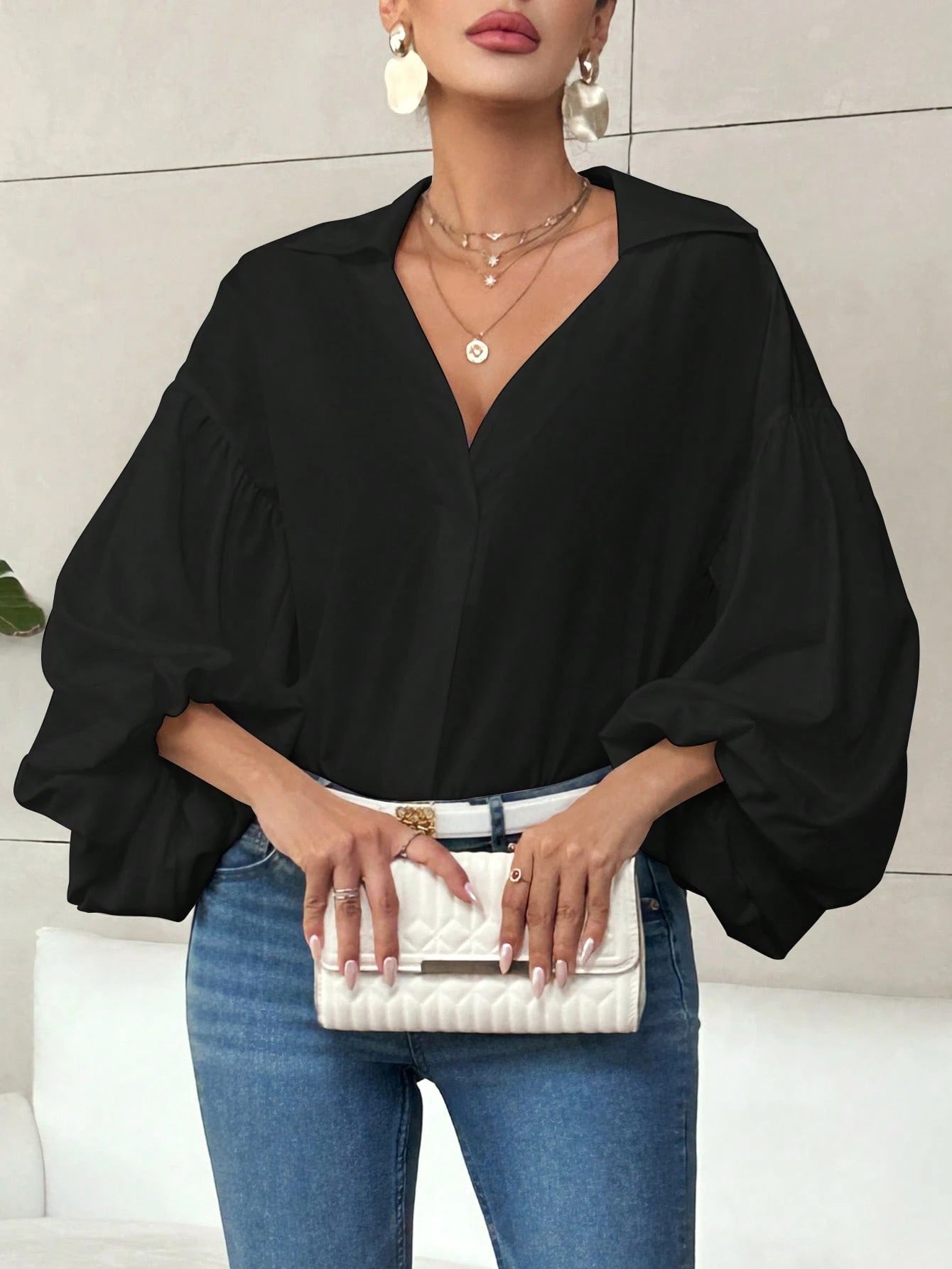 Long-sleeve polka dot top with a half-zip neck