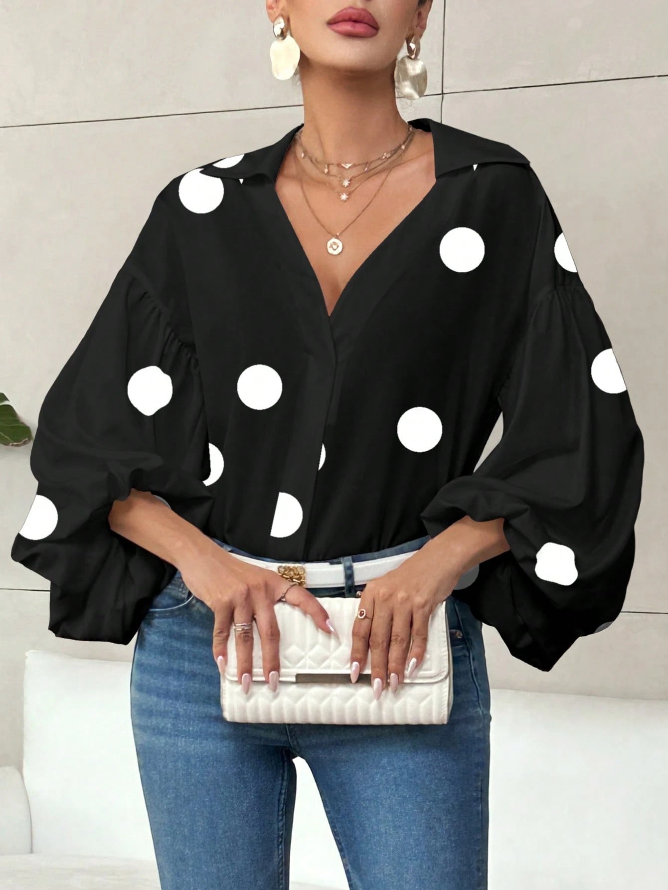 Long-sleeve polka dot top with a half-zip neck