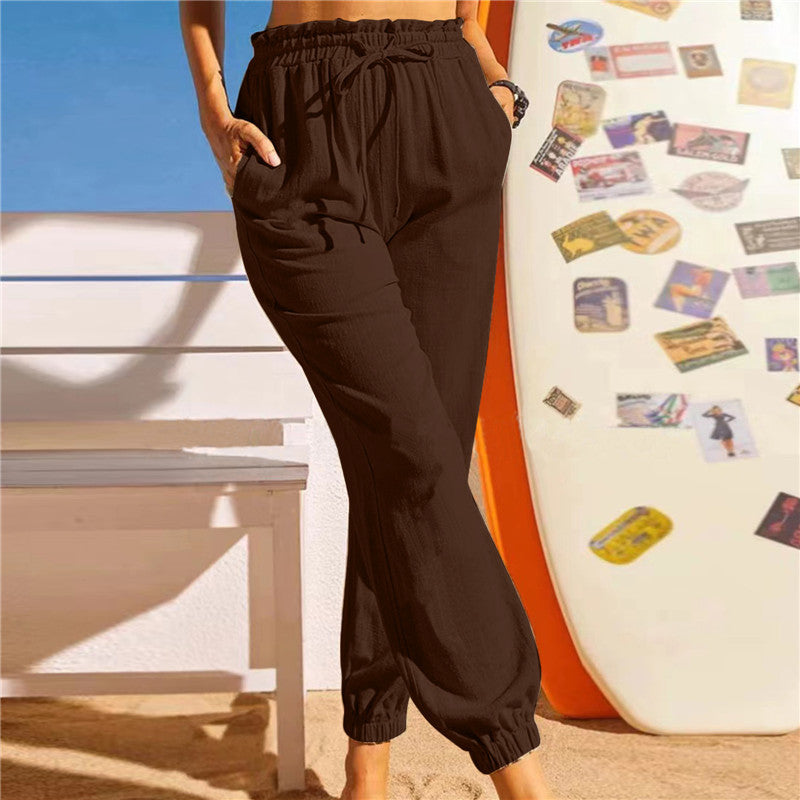 Pantalón de lino con cintura elástica y bajo en pétalo