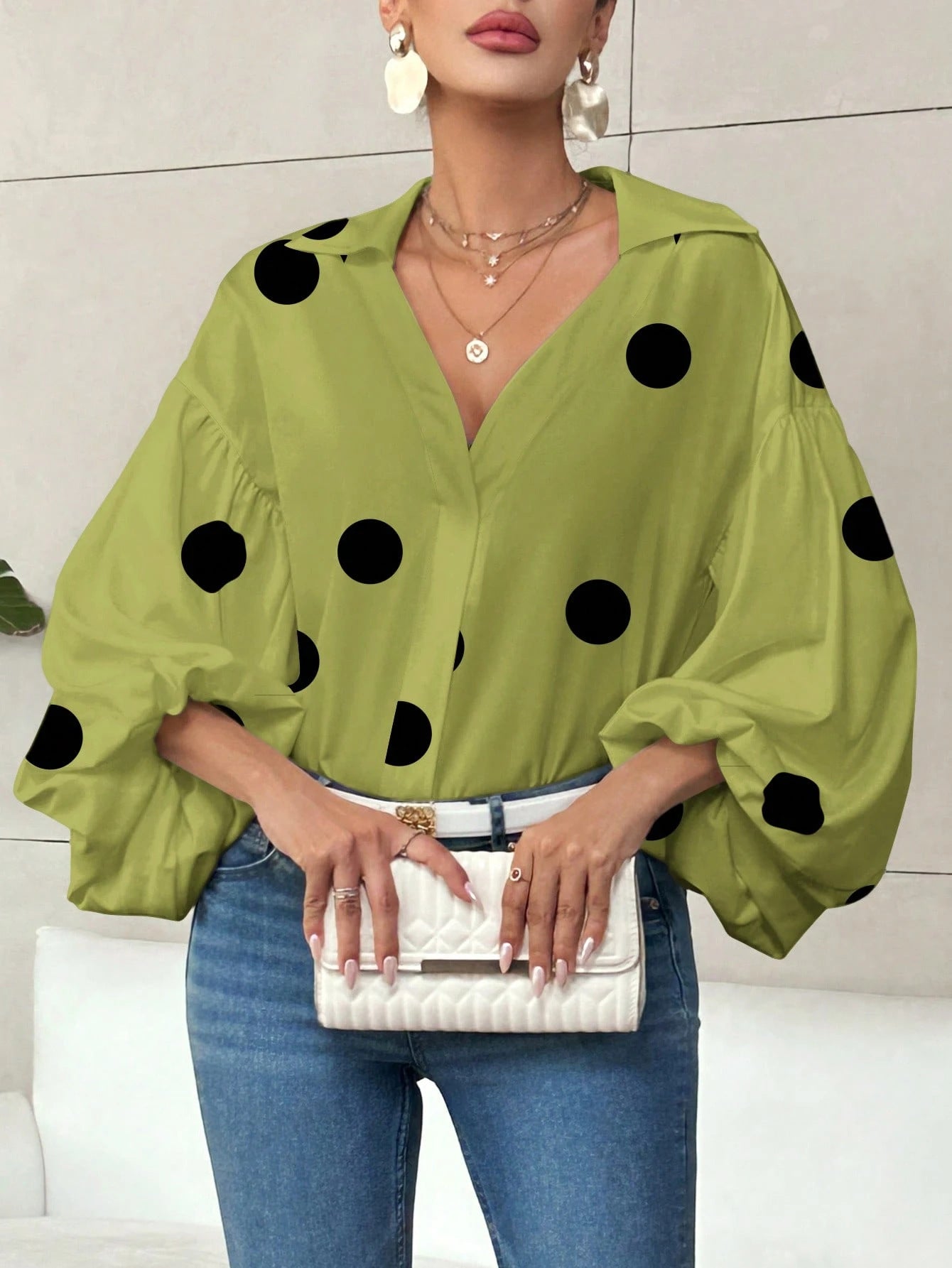 Long-sleeve polka dot top with a half-zip neck