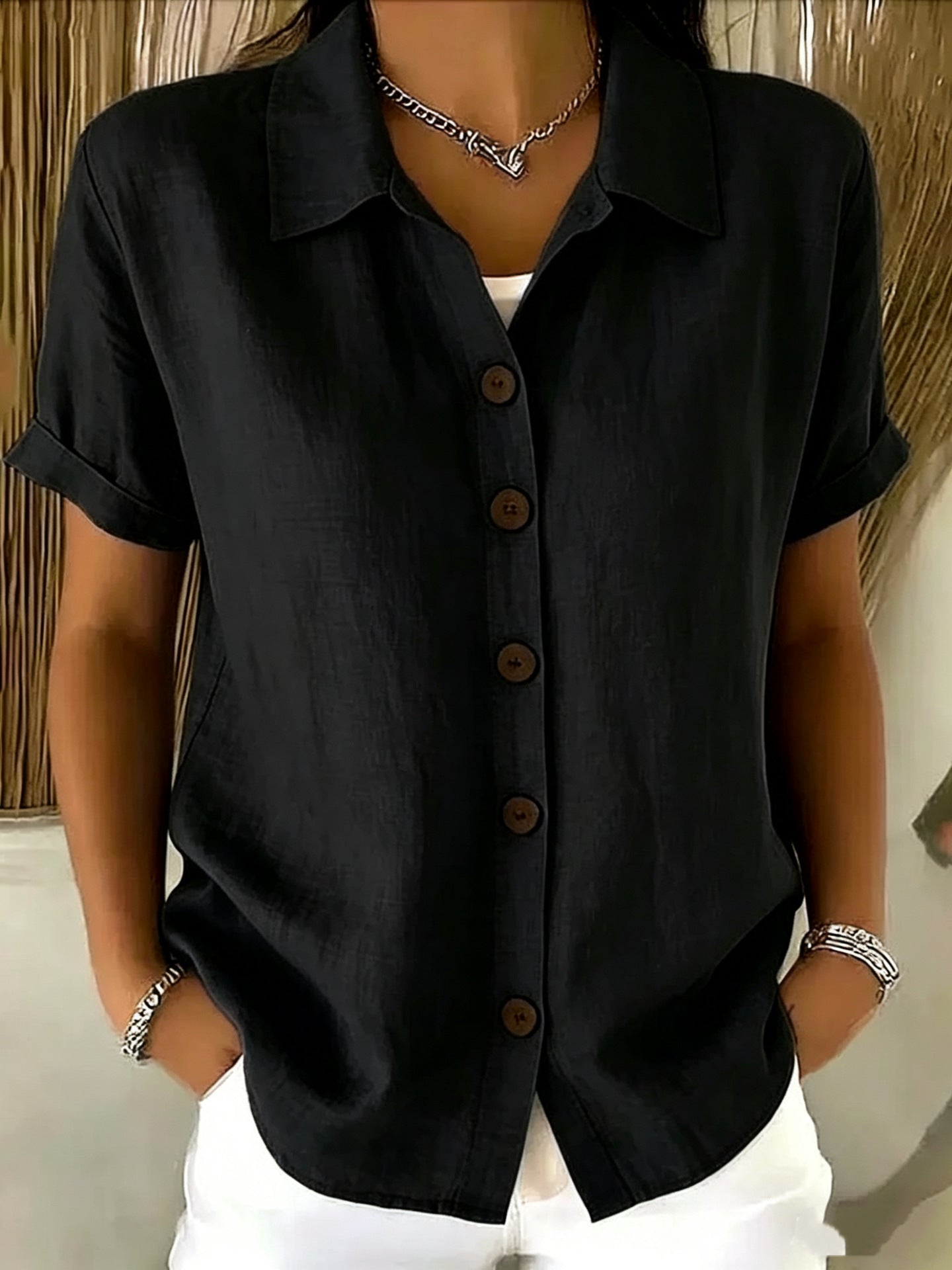 Top de manga corta con cuello camisero y botones