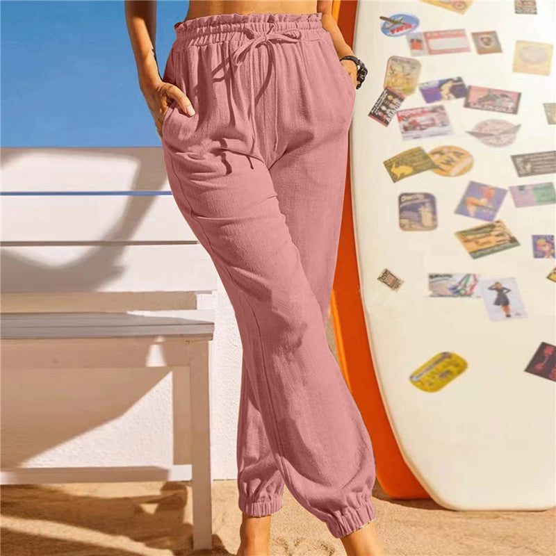 Pantalón de lino con cintura elástica y bajo en pétalo
