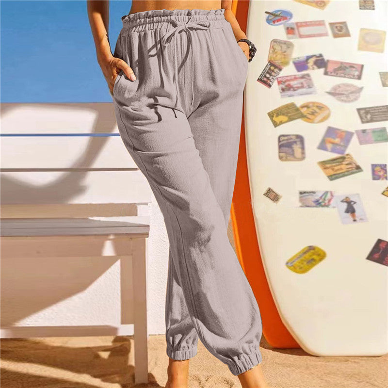 Pantalón de lino con cintura elástica y bajo en pétalo